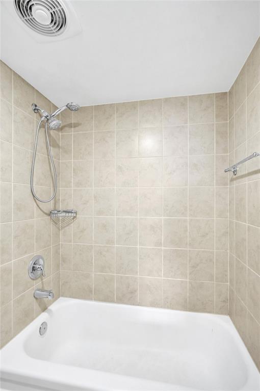 1900 South Ocean Boulevard, Unit 2F Lauderdale-by-the-Sea, FL 33062 - Photo 16 of 34 a bathroom with a bathtub