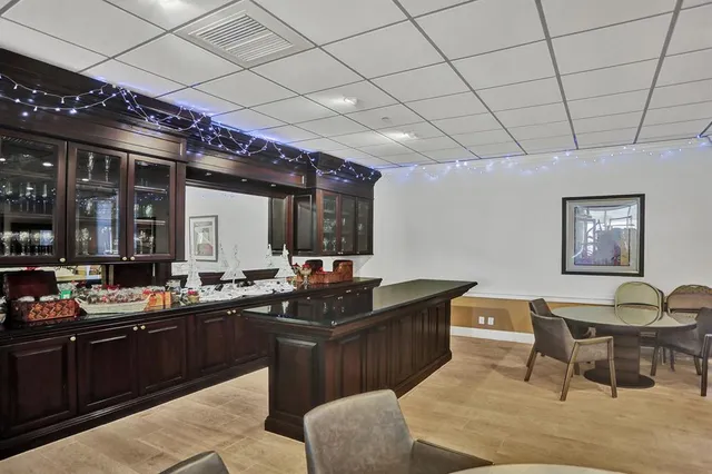 a view of a swimming pool with a lounge chair