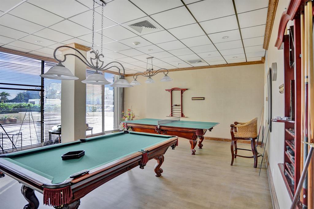 1900 South Ocean Boulevard, Unit 2F Lauderdale-by-the-Sea, FL 33062 - Photo 27 of 34 a room with gym equipment