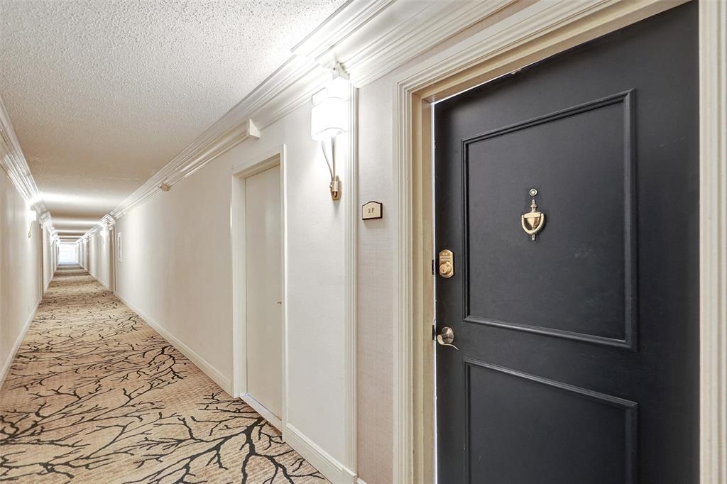1900 South Ocean Boulevard, Unit 2F Lauderdale-by-the-Sea, FL 33062 - Photo 7 of 34 a view of a hallway with wooden floor and closet