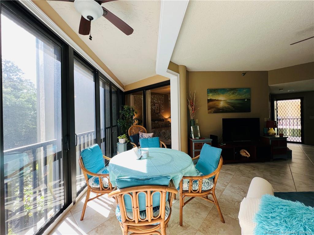 221 Northeast Plantation Road, Unit 215 Stuart, FL 34996 - Photo 22 of 83 a view of a dining room with furniture window and wooden floor