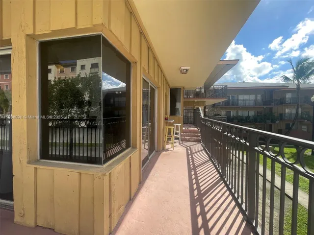 a view of balcony with a potted plant