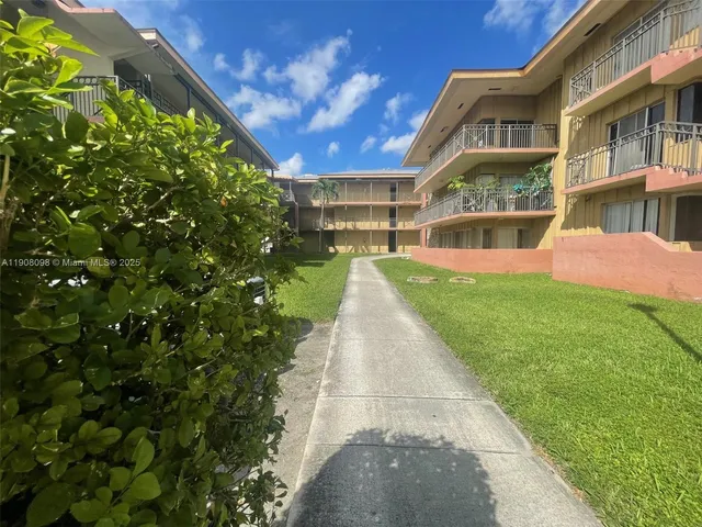 a view of building with yard