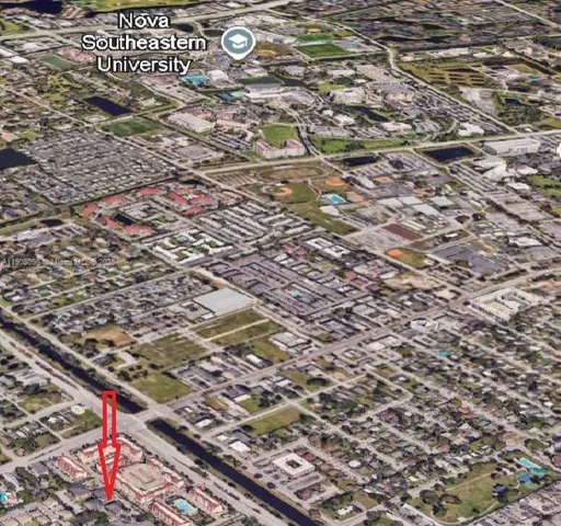 an aerial view of residential house with outdoor space