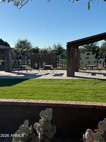 a front view of a yard with table and chairs