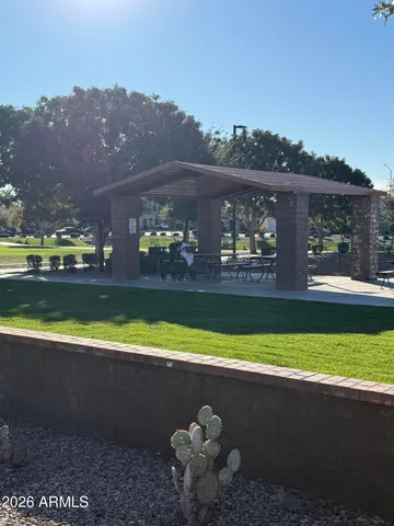 a view of swimming pool with a yard and outdoor seating