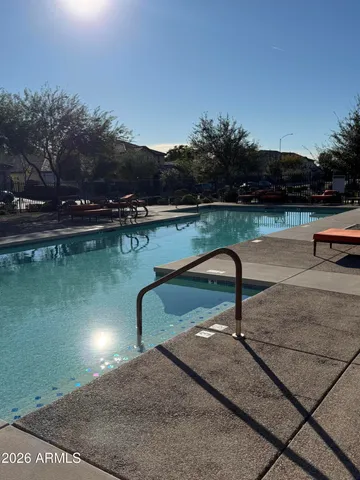 a view of a swimming pool and a yard