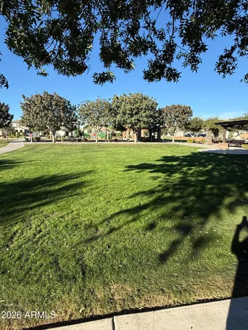 a view of a golf course with a lake view