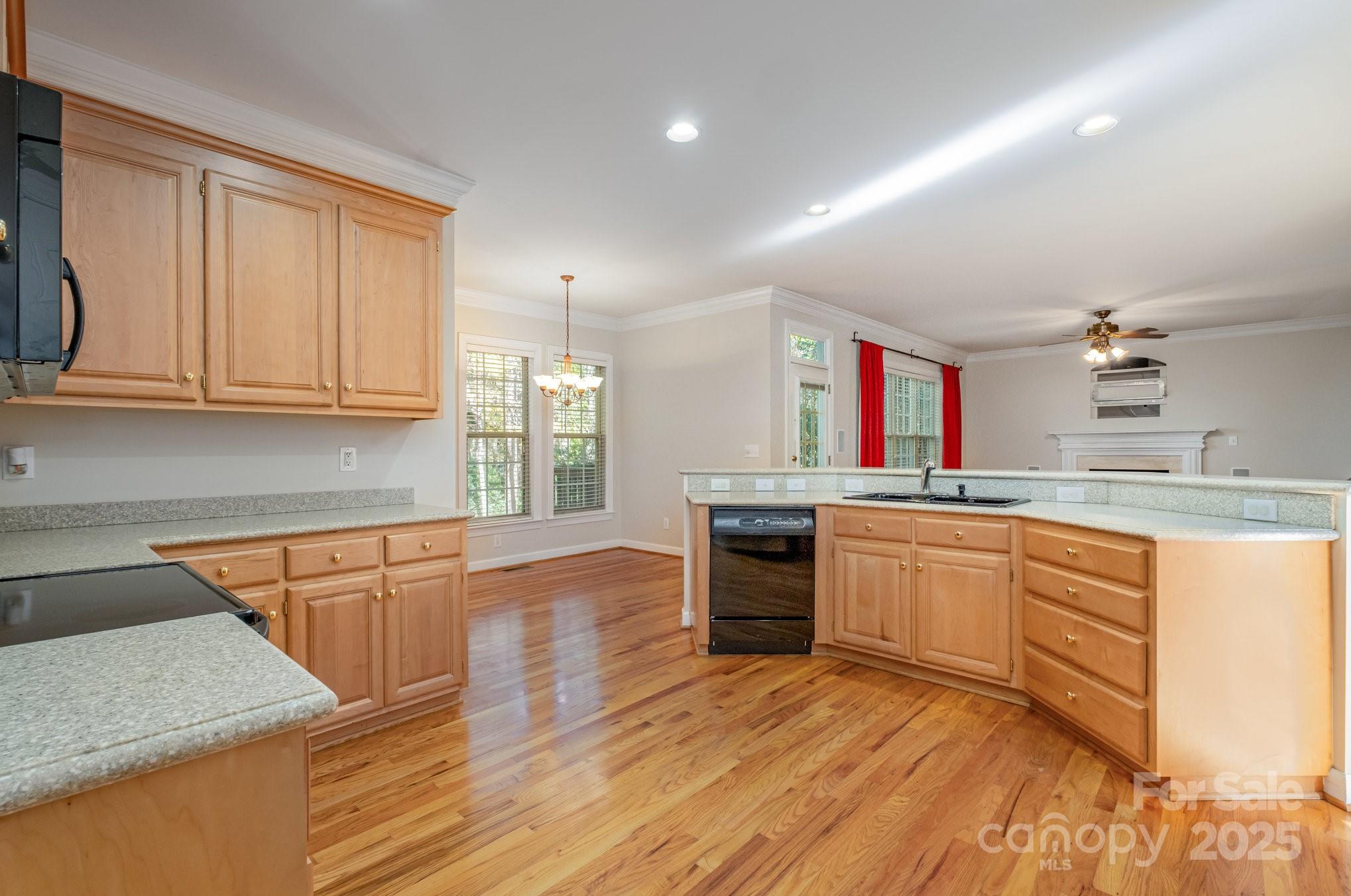 1930 Copperplate Road Charlotte, NC 28262 - Photo 11 of 43 a kitchen with stainless steel appliances granite countertop a sink stove and cabinets