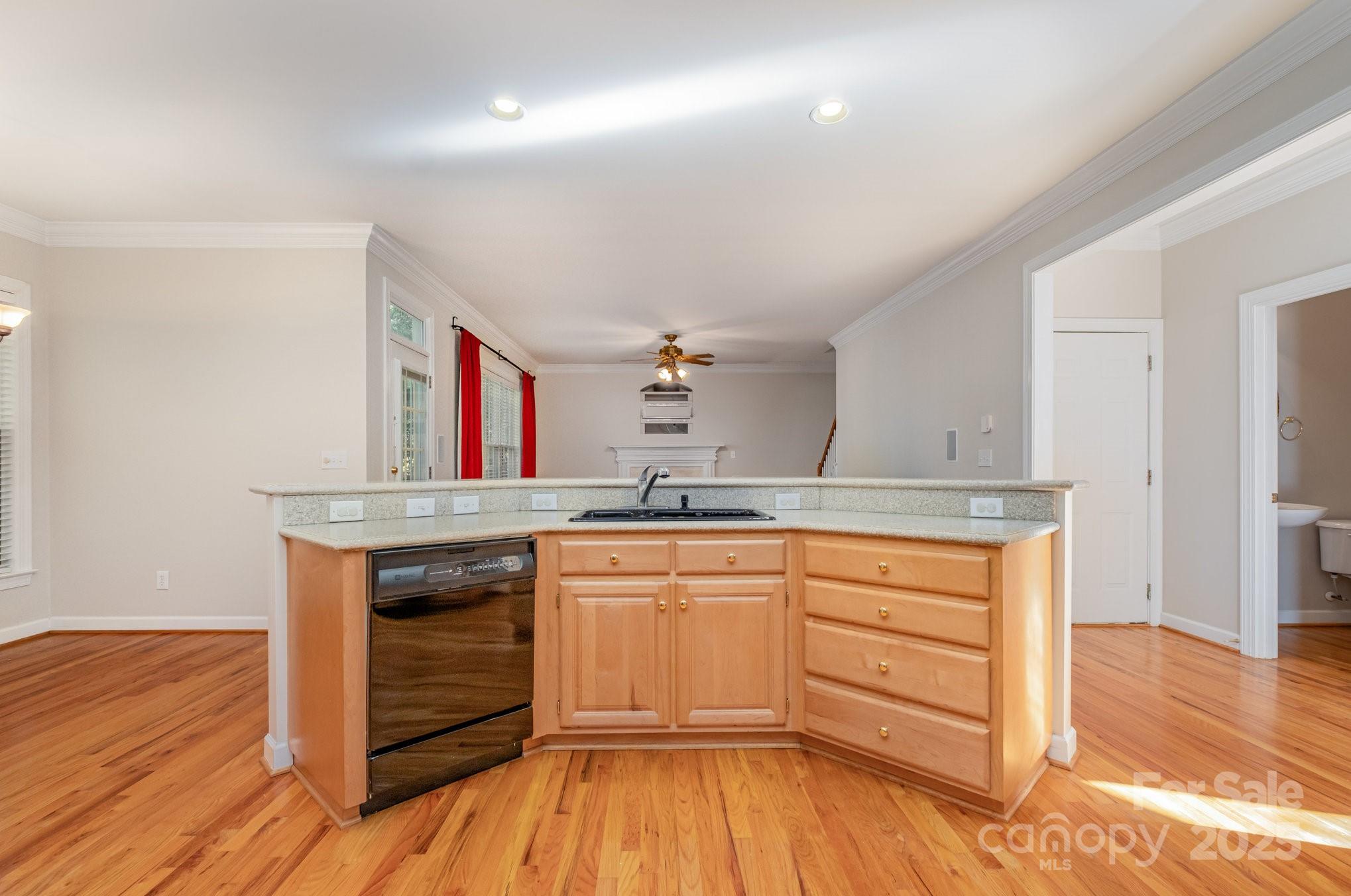 1930 Copperplate Road Charlotte, NC 28262 - Photo 12 of 43 a kitchen with granite countertop white cabinets and white appliances