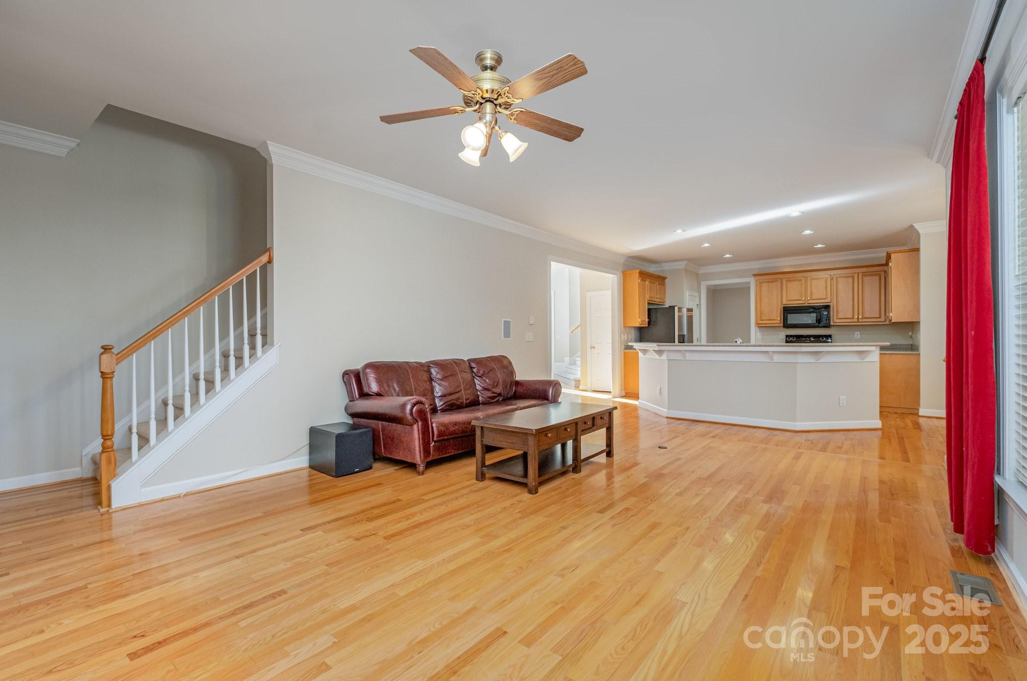 1930 Copperplate Road Charlotte, NC 28262 - Photo 20 of 43 a living room with furniture and a wooden floor