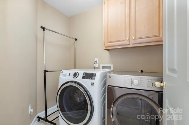 a bathroom with a double vanity sink toilet mirror and shower