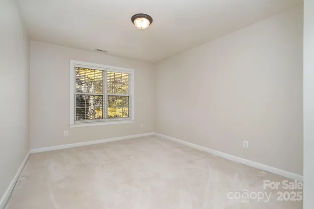 a room with a table chairs and wooden floor