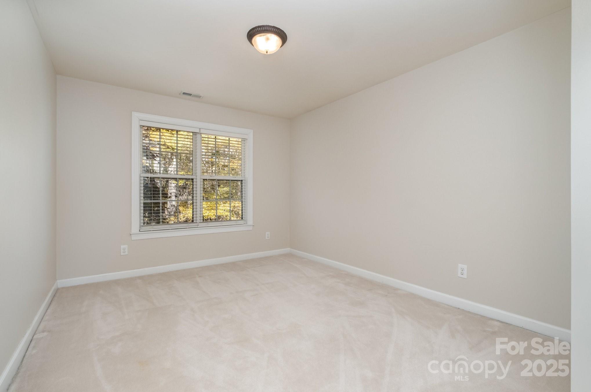 1930 Copperplate Road Charlotte, NC 28262 - Photo 30 of 43 an empty room with windows