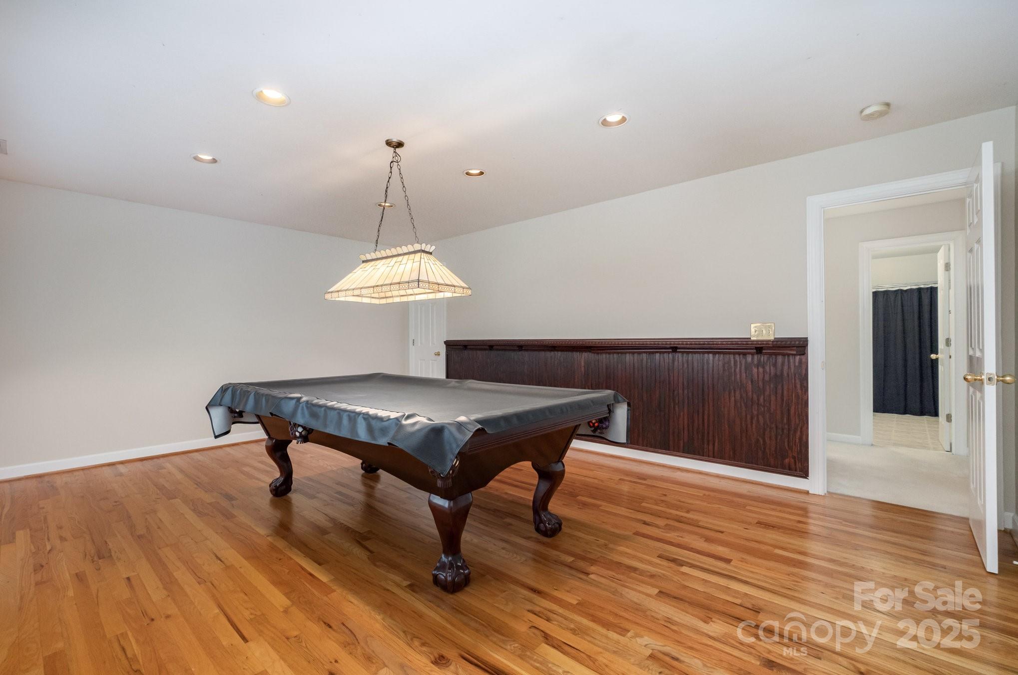 1930 Copperplate Road Charlotte, NC 28262 - Photo 31 of 43 a room with a table chairs and wooden floor