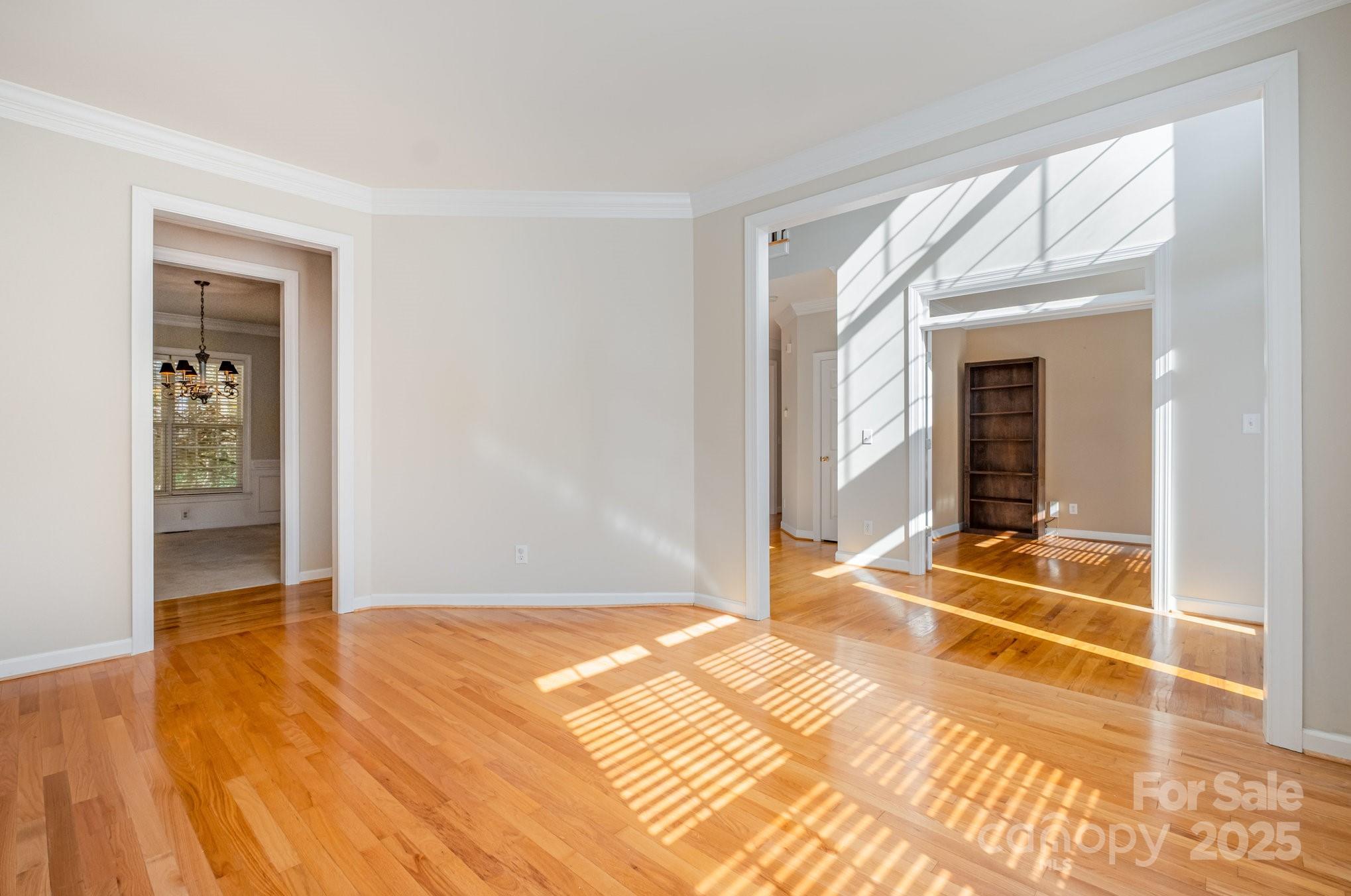 1930 Copperplate Road Charlotte, NC 28262 - Photo 7 of 43 a view of a room with wooden floor and windows