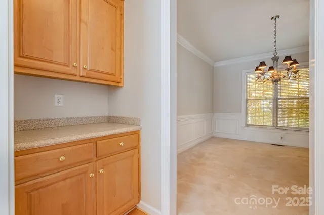 a view of a storage and utility room with window