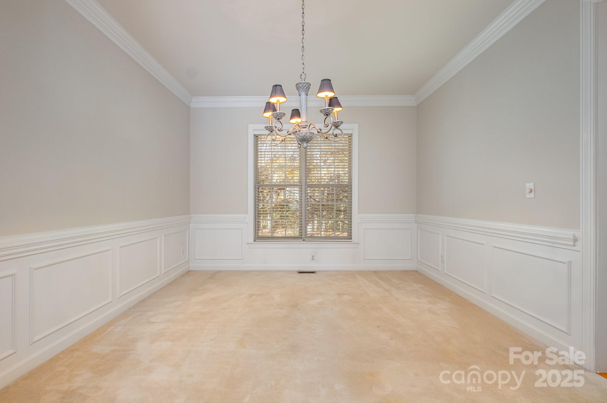 1930 Copperplate Road Charlotte, NC 28262 - Photo 9 of 43 a big room with chandelier and windows