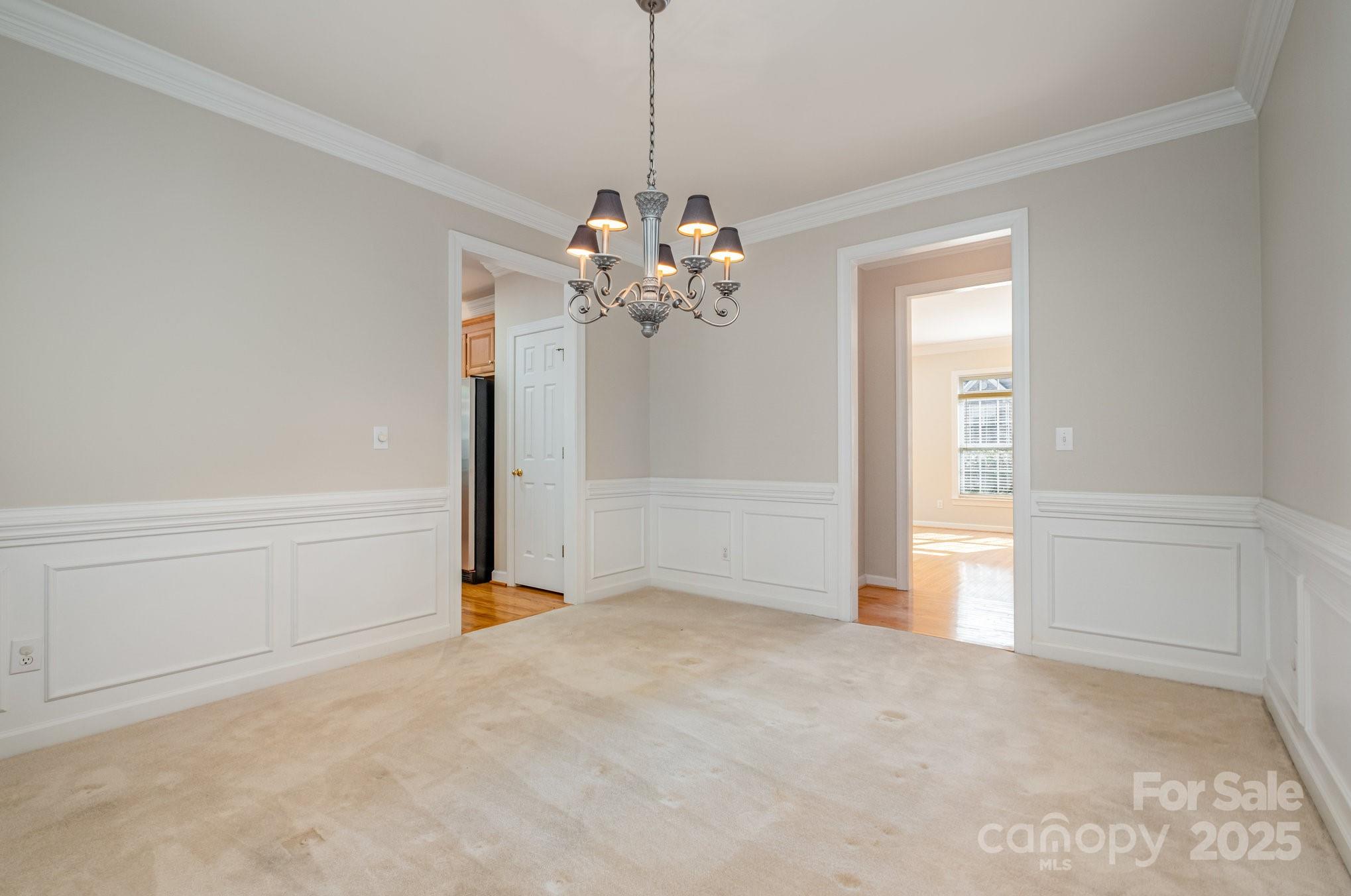 1930 Copperplate Road Charlotte, NC 28262 - Photo 10 of 43 a view of a chandelier in big room and chandelier fan