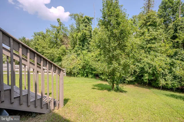 a view of a house with swimming pool patio and a yard