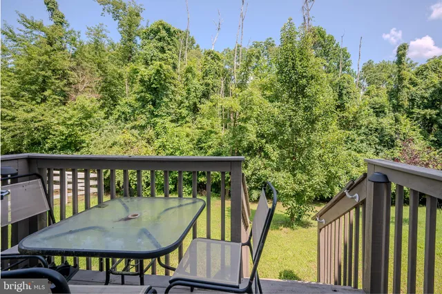 a view of a balcony with chairs