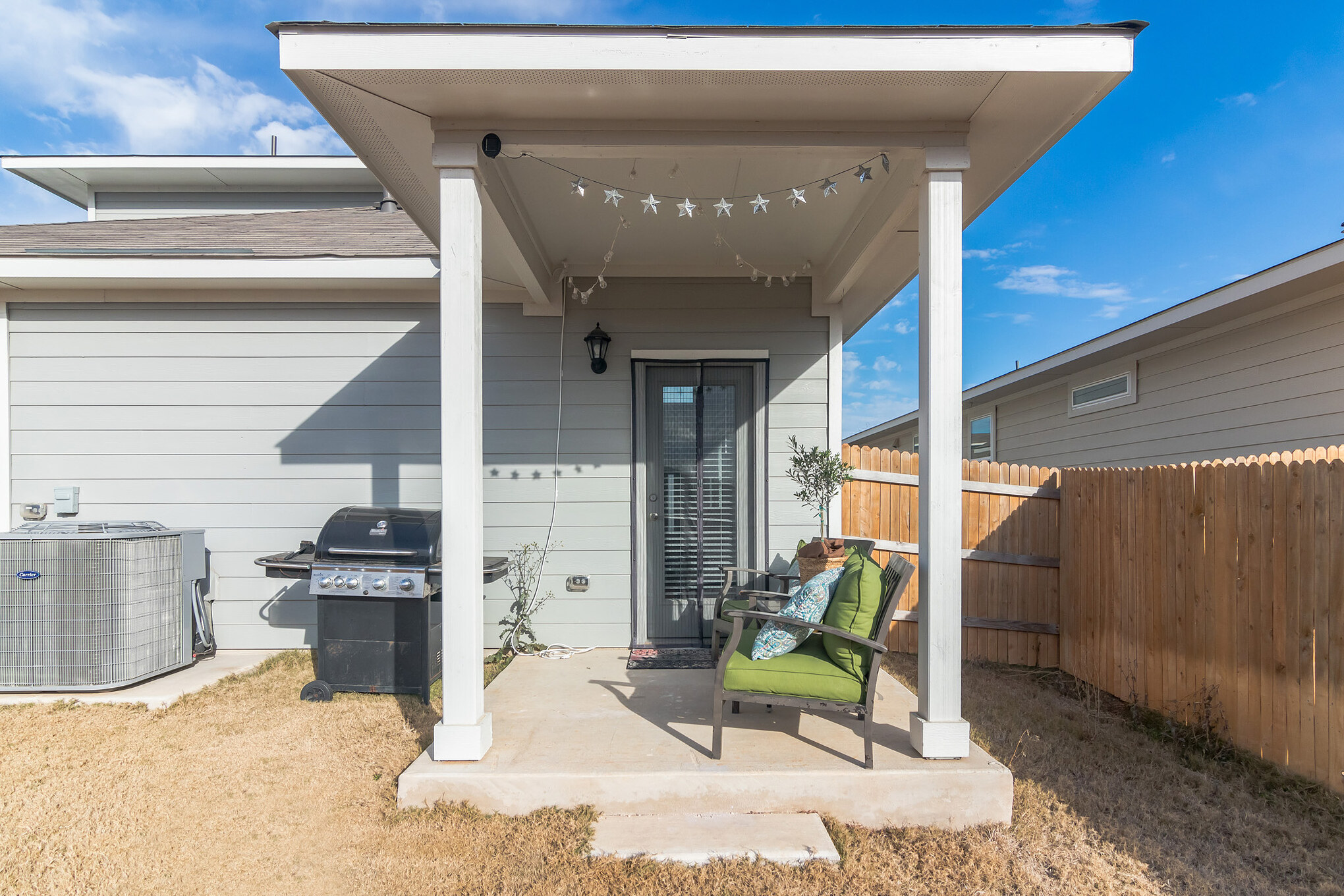 116 Century Plant Road Leander, TX 78641 - Photo 29 of 30 A sheltered back porch transitions smoothly to the fenced yard.