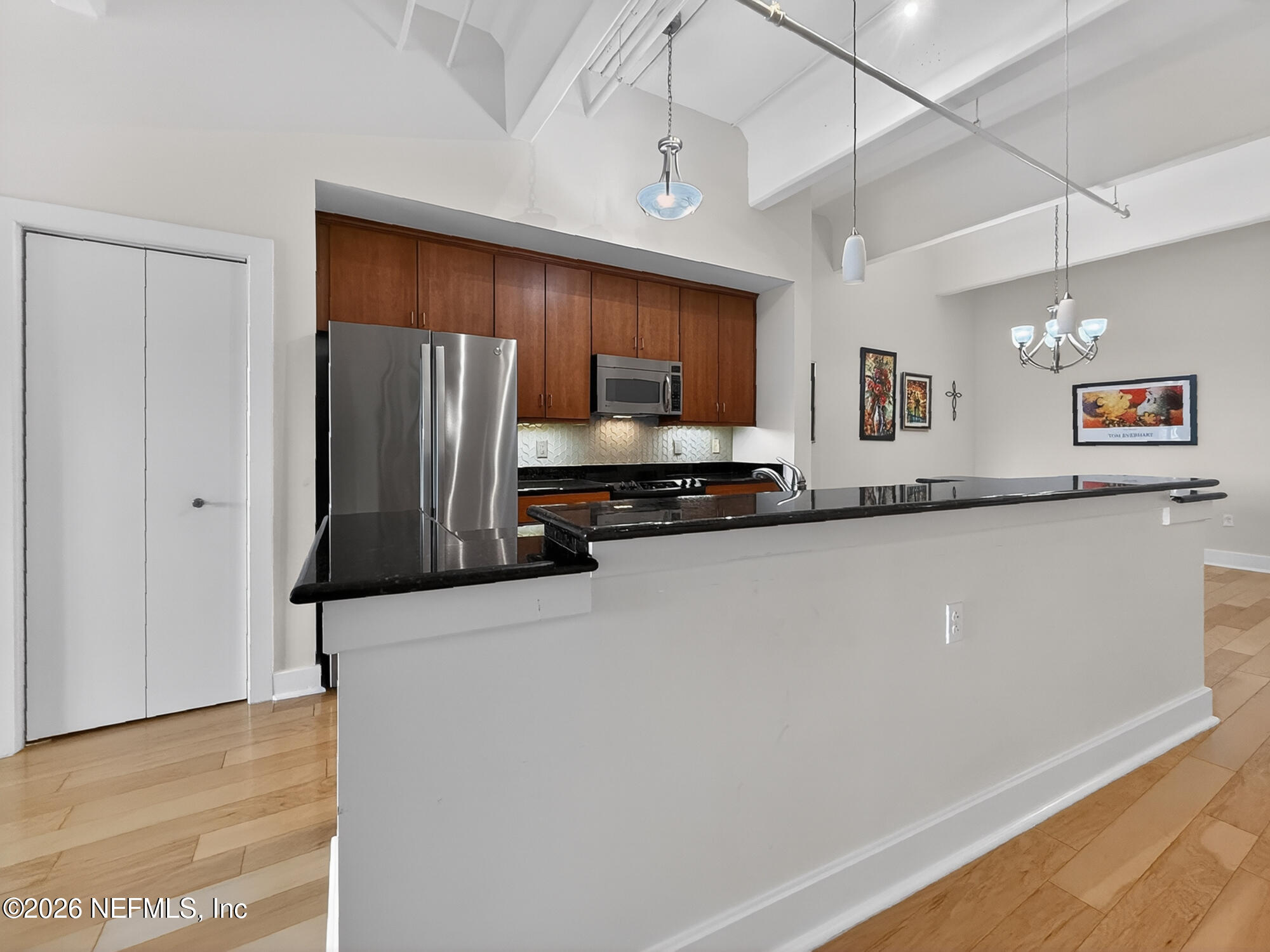 1661 Riverside Avenue, Unit 407 Jacksonville, FL 32204 - Photo 10 of 60 a kitchen with stainless steel appliances a refrigerator and a stove top oven