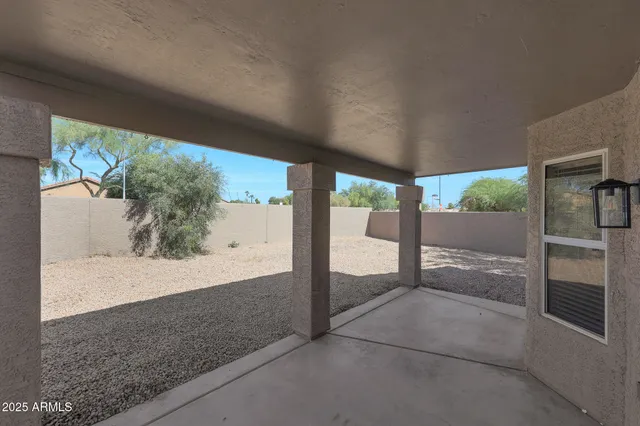 a view of a glass door and a yard