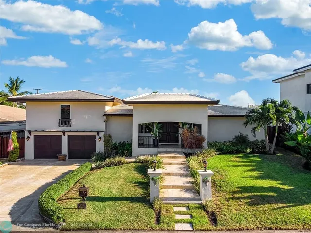 a view of a house with swimming pool and a yard