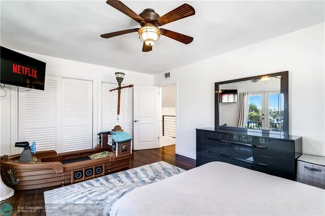 a bathroom with a sink toilet a mirror and shower