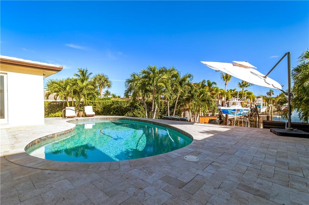 2948 Northeast 35th Court Lighthouse Point, FL 33064 - Photo 19 of 24 a view of swimming pool