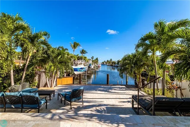 an aerial view of a house with a ocean view