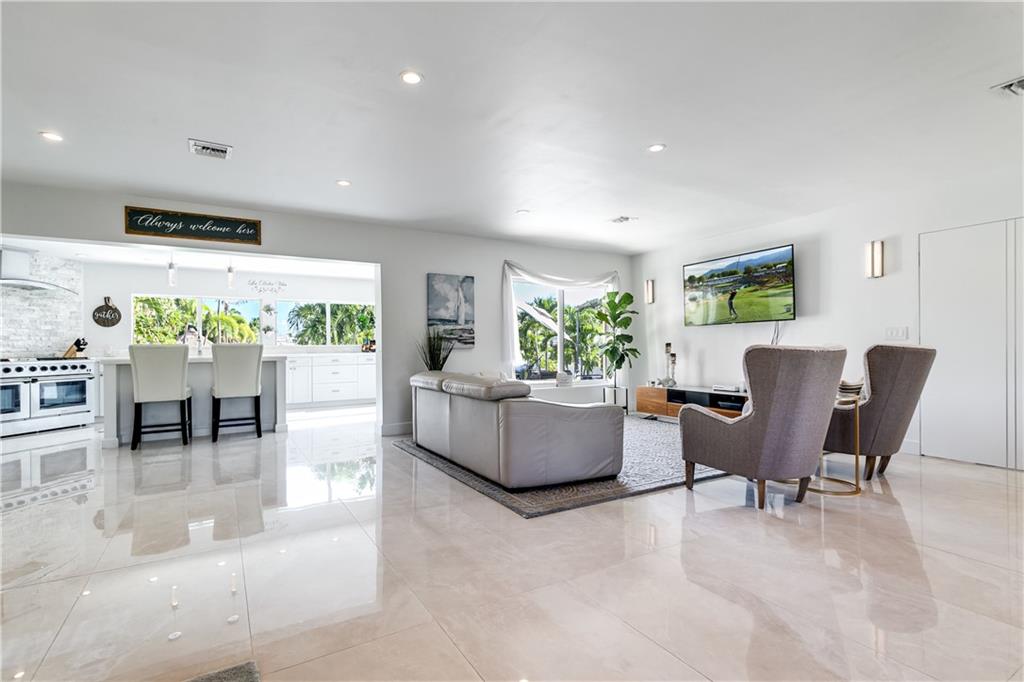 2948 Northeast 35th Court Lighthouse Point, FL 33064 - Photo 4 of 24 a living room with furniture and a large window