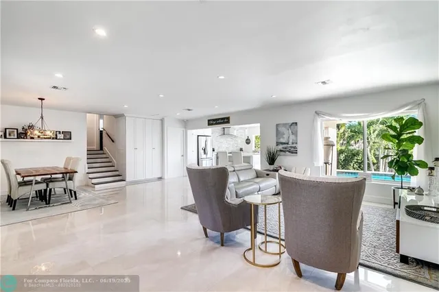 a view of a dining room with furniture window and outside view