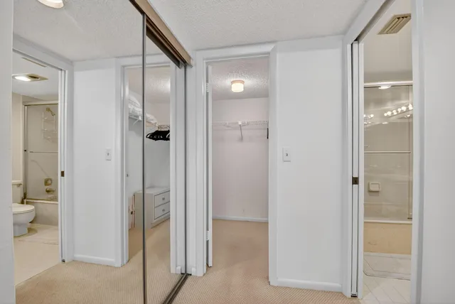 a bathroom with a glass shower door