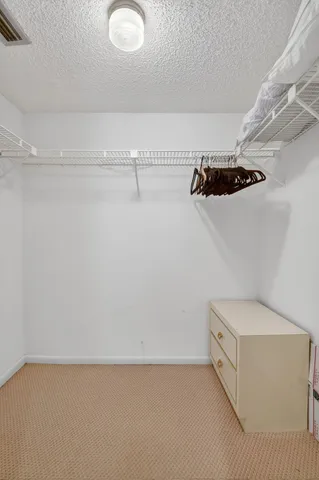 a view of a room with racks on the wall