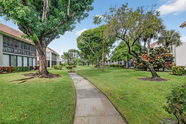 a view of a garden with a apartment