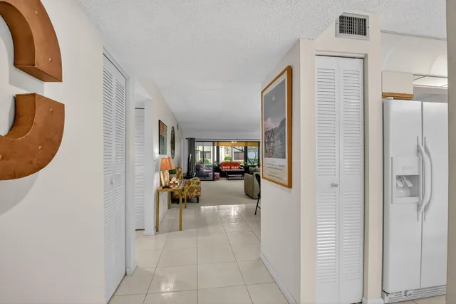 a view of a hallway with couch and furniture