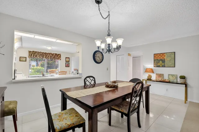 a view of a dining room and a table and chairs