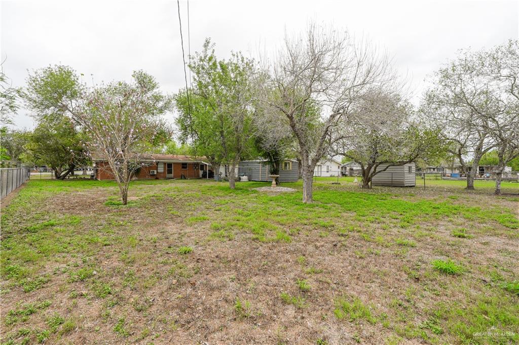 425 South Reynolds Rio Hondo, TX 78583 - Photo 23 of 23 The property features an expansive yard with established trees and green spaces