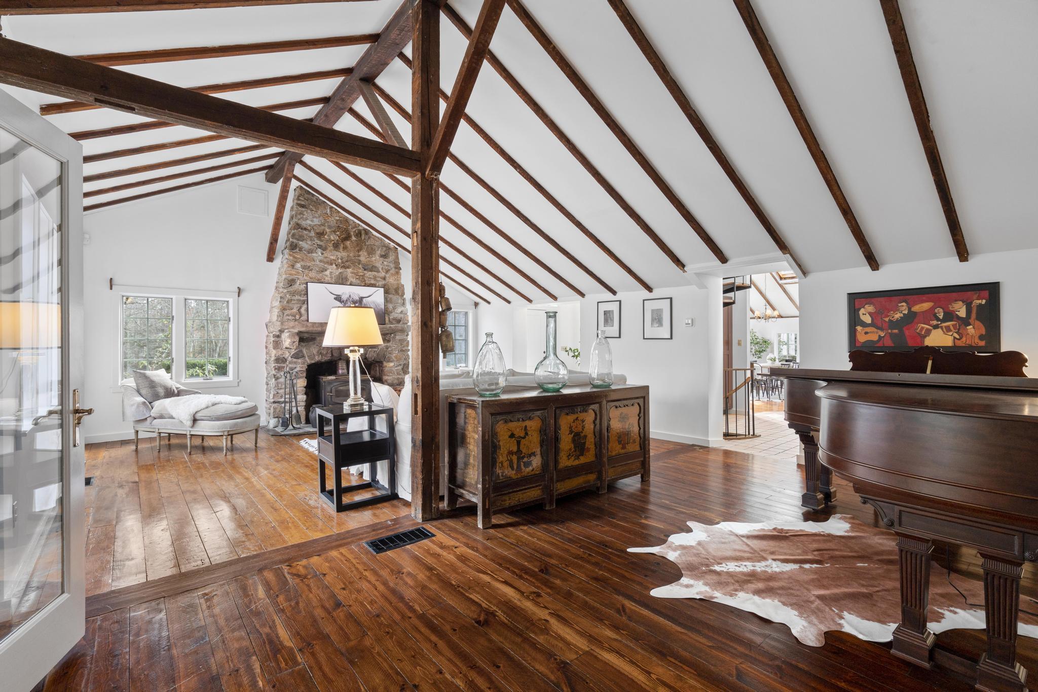 381 West Mountain Road Ridgefield, CT 06877 - Photo 12 of 35 a living room with furniture and a flat screen tv