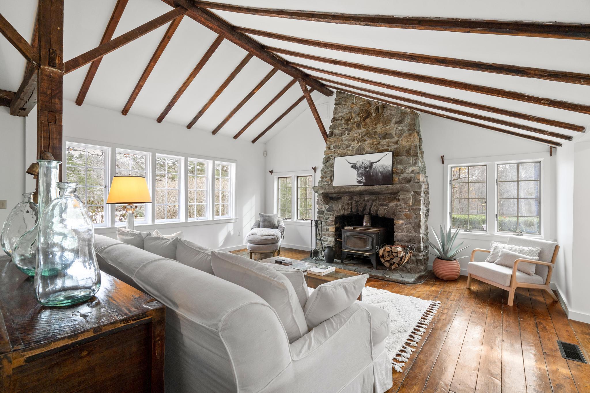 381 West Mountain Road Ridgefield, CT 06877 - Photo 13 of 35 a living room with furniture and a fireplace