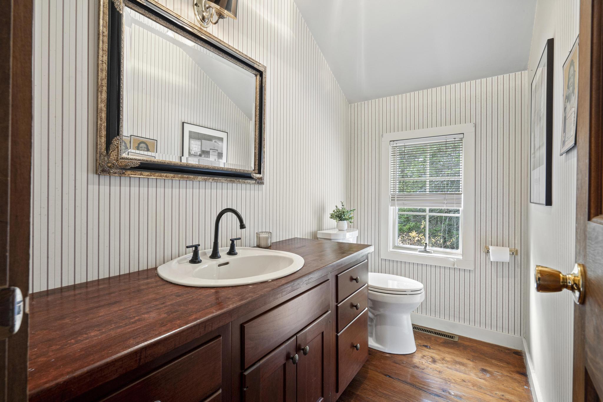 381 West Mountain Road Ridgefield, CT 06877 - Photo 20 of 35 a bathroom with a sink a toilet and a mirror