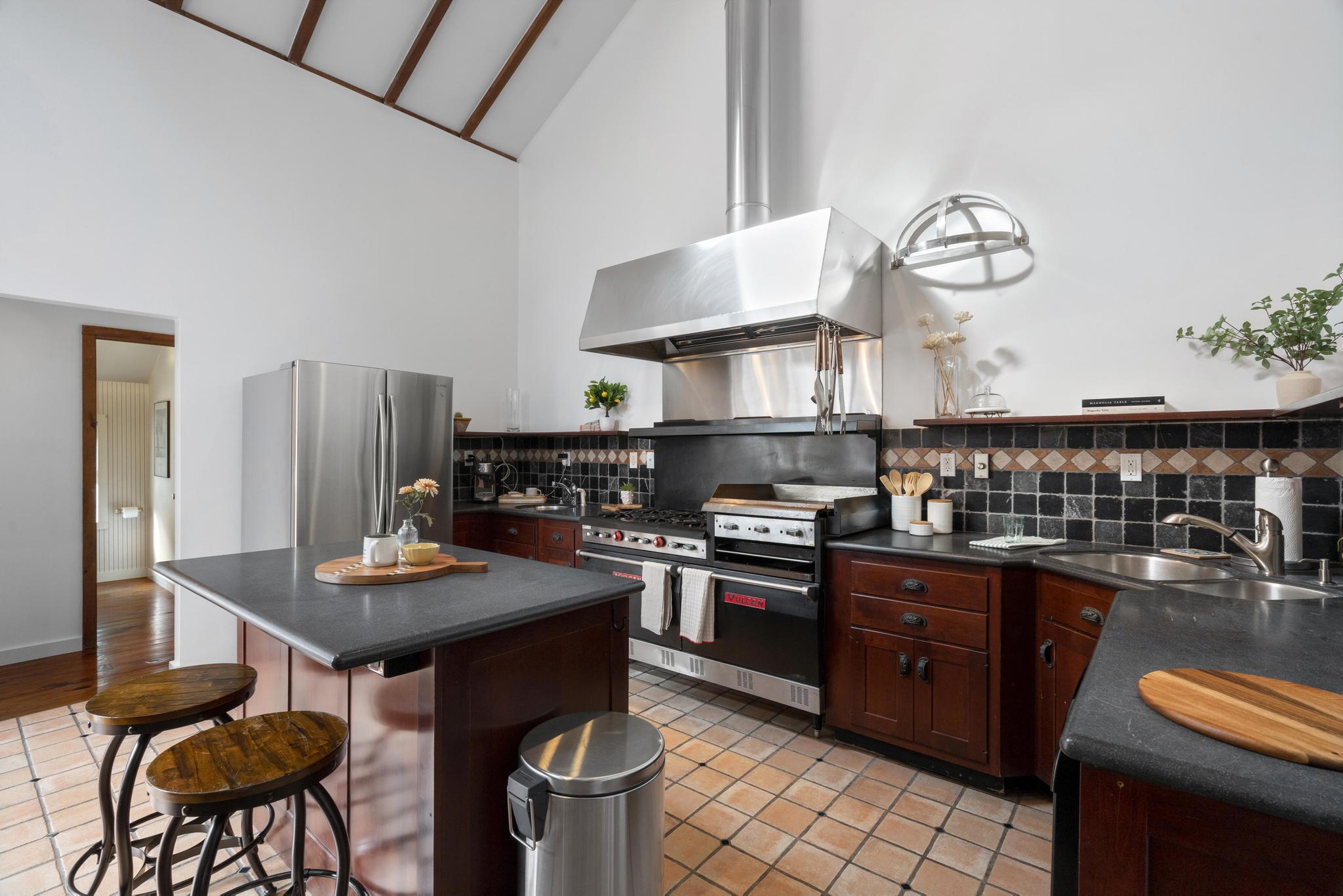 381 West Mountain Road Ridgefield, CT 06877 - Photo 9 of 35 a kitchen with stainless steel appliances granite countertop a sink a stove and a wooden cabinets