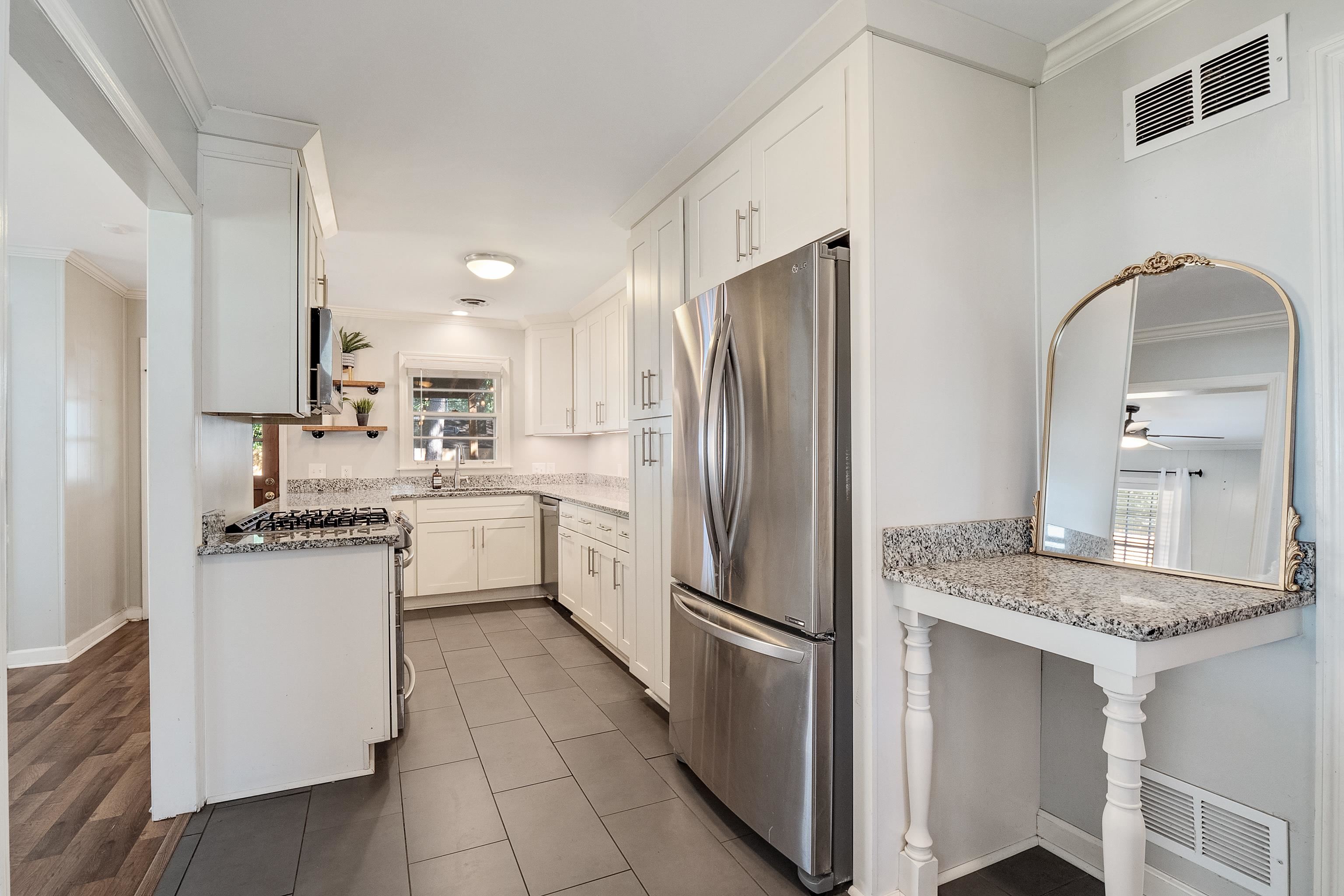 1216 West Perkins Road Memphis, TN 38117 - Photo 11 of 30 a kitchen with a refrigerator sink and stove