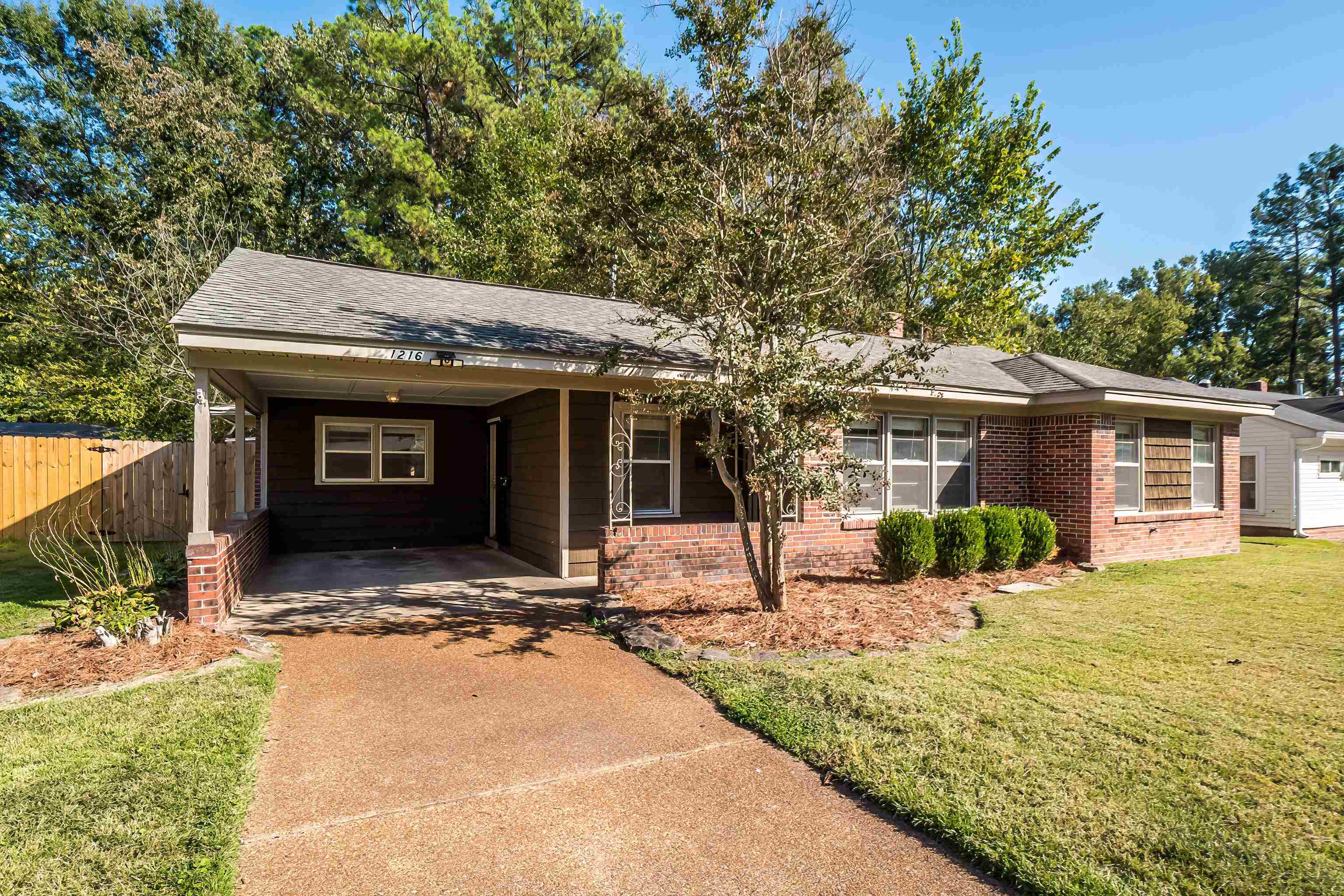 1216 West Perkins Road Memphis, TN 38117 - Photo 2 of 30 a house view with a sitting space and garden space