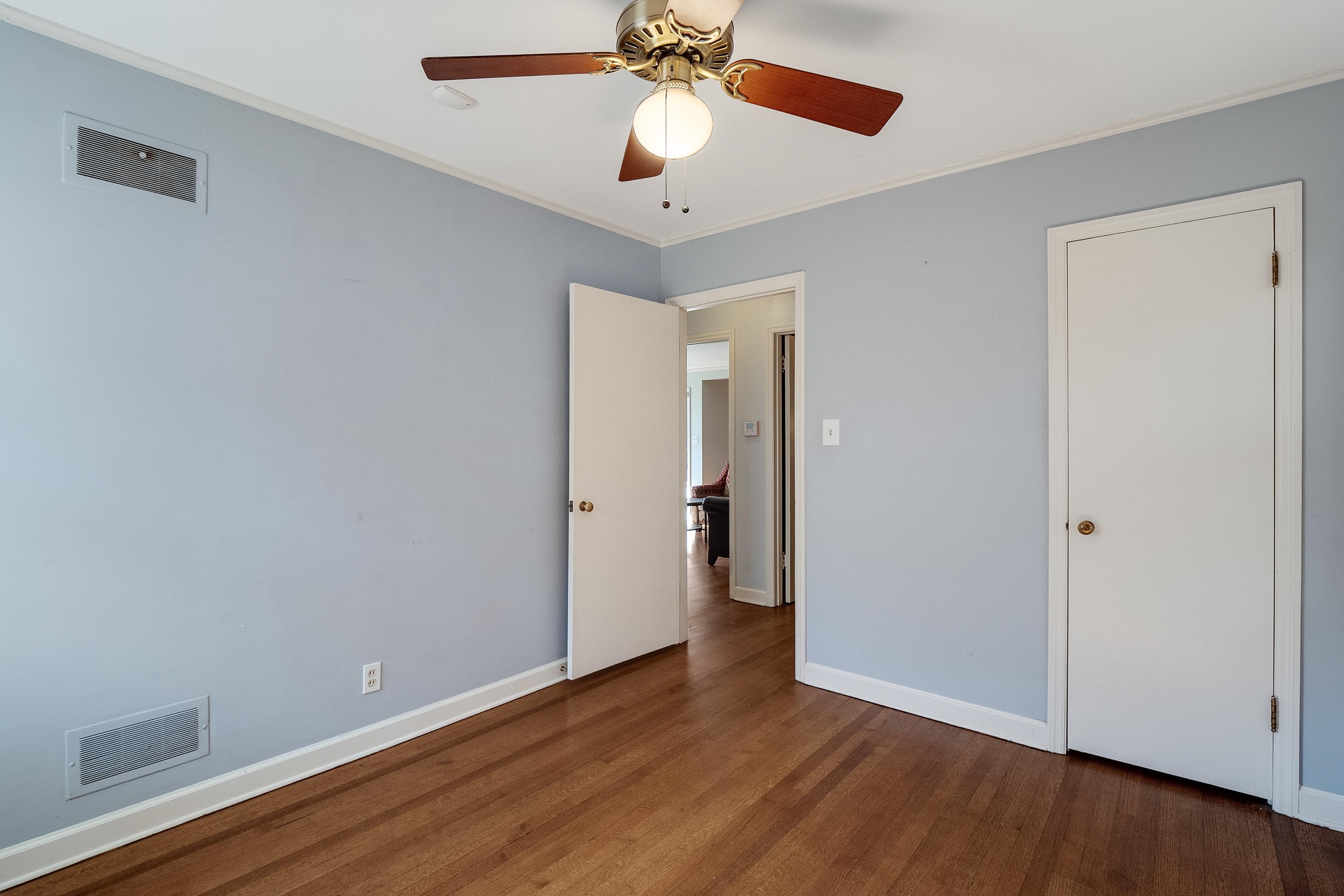 1216 West Perkins Road Memphis, TN 38117 - Photo 26 of 30 a view of an empty room with wooden floor