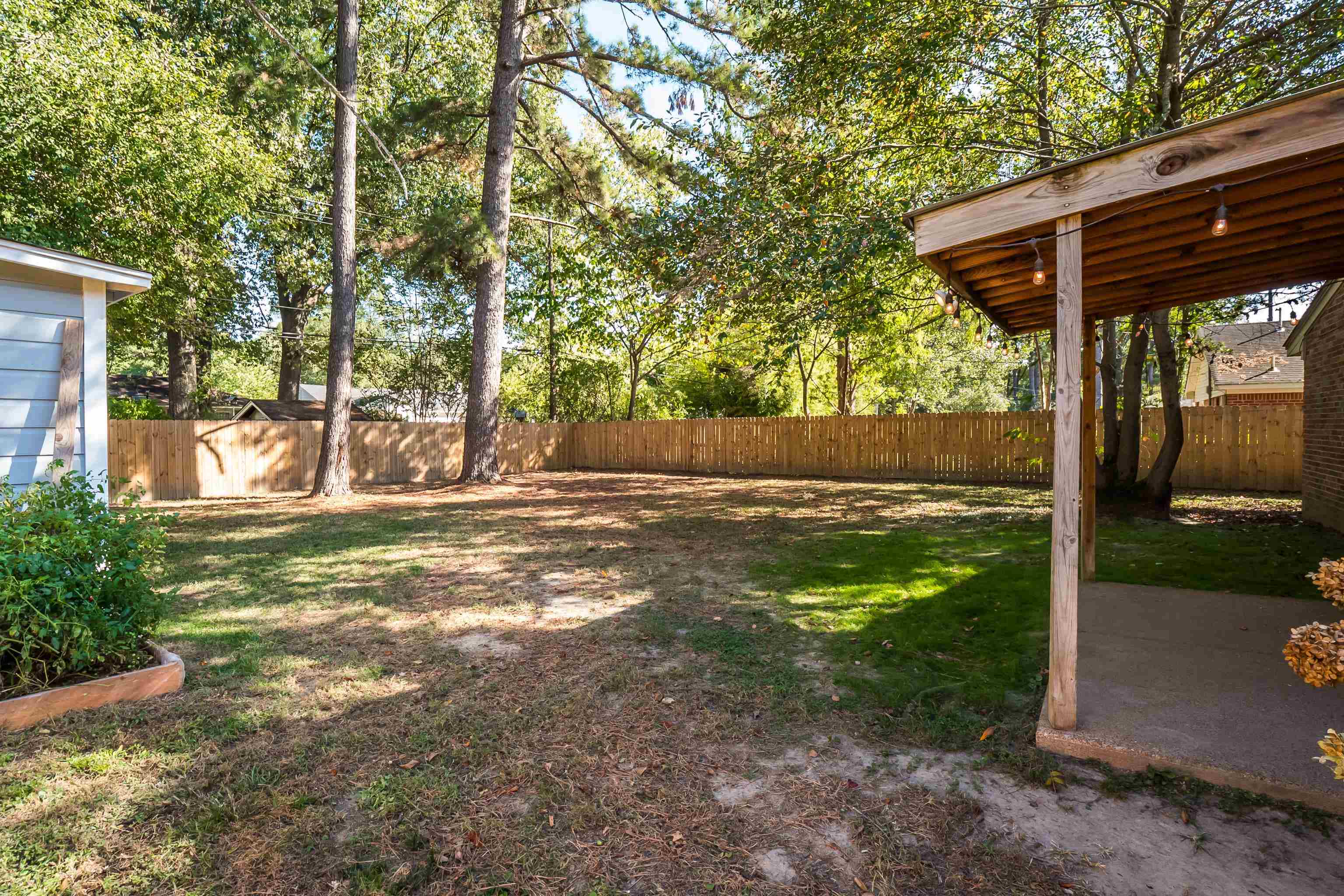 1216 West Perkins Road Memphis, TN 38117 - Photo 28 of 30 a view of a wooden deck with a yard