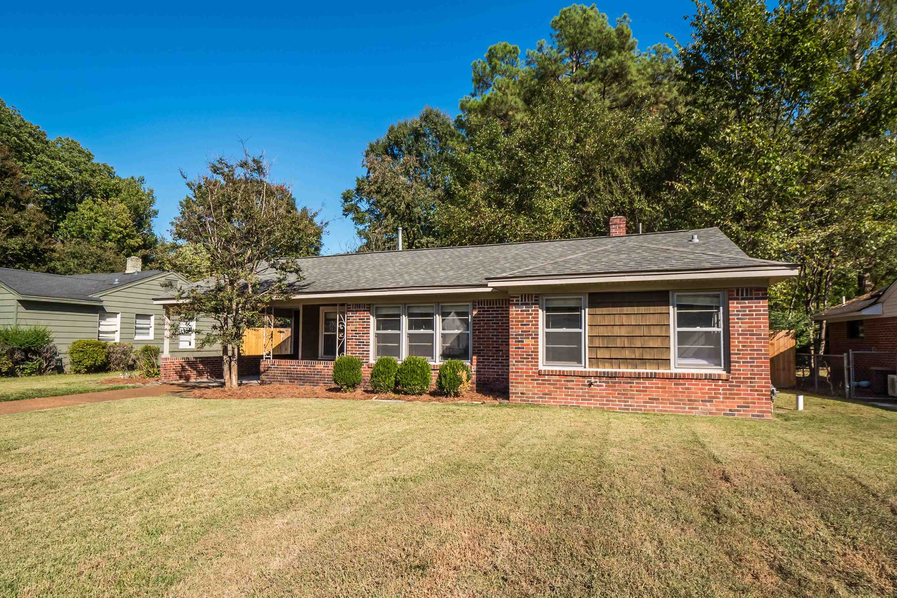 1216 West Perkins Road Memphis, TN 38117 - Photo 4 of 30 a front view of a house with a yard