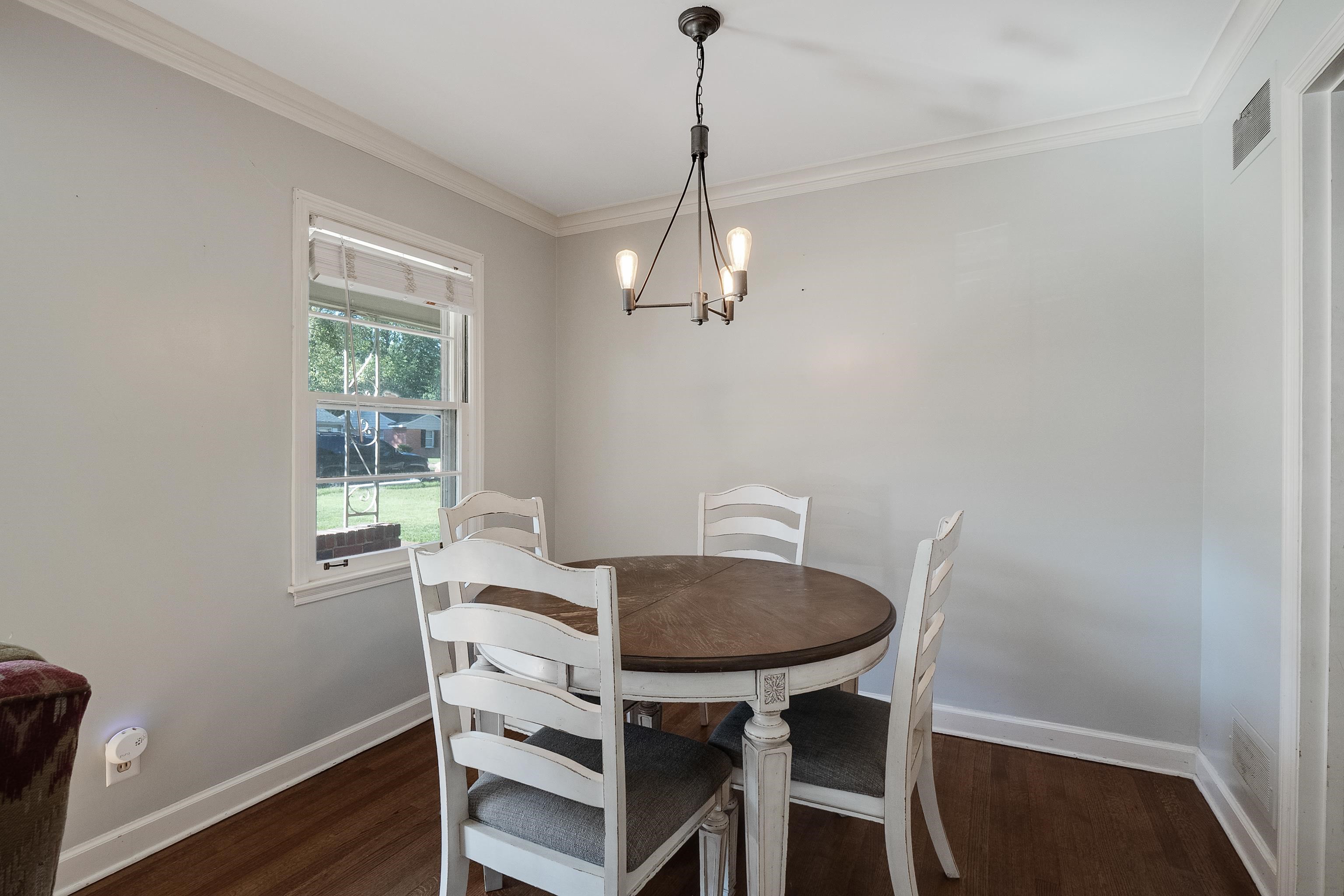 1216 West Perkins Road Memphis, TN 38117 - Photo 9 of 30 a view of a dining room with furniture window and wooden floor